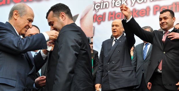 YÜCEL'İN ROZETİNİ BAHÇELİ TAKTI